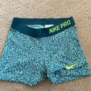 Teal blue nike pros